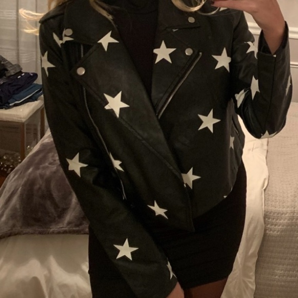 Size small black leather jacket with white stars. Worn once perfect condition.